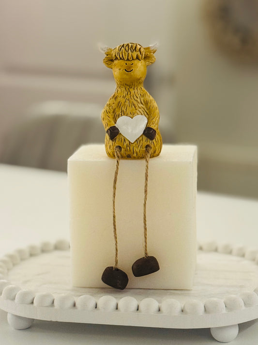 Sitting Highland cow