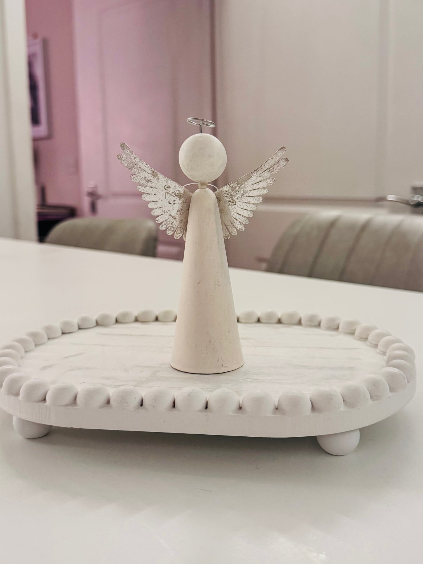 Wooden angel with metal wings