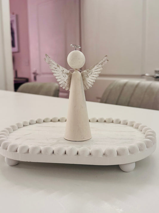 Wooden angel with metal wings