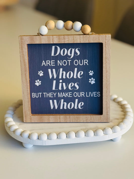 Dogs are our whole lives sign.